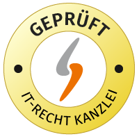 Kuvassa näkyy IT-Recht-Kanzlein pyöreä logo keltaisella ja valkoisella, tekstillä ”AUDITED GTC”.